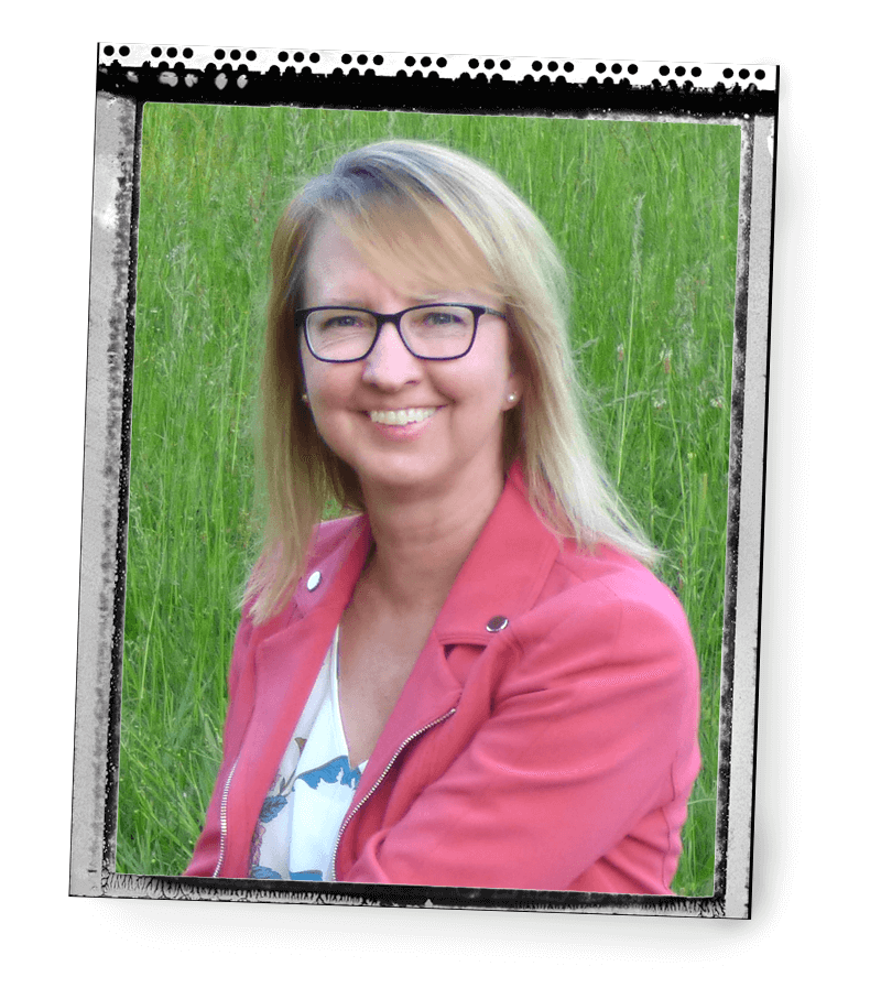 Jackie Brown smiling with green grass background