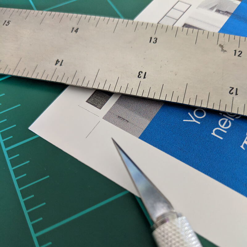 ruler with proof and craft knife