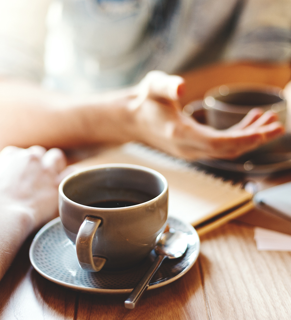 woman entering conference room as seen from behind her